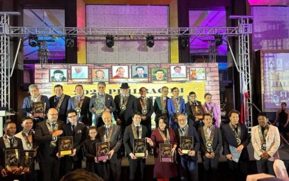 <p><strong>RECOGNITION.</strong> Philippine Racing Commission (Philracom) officials pose for a photo with recipients of the Hall of Fame awards during a ceremony at the Manila Diamond Hotel Grand Ballroom in Manila on Dec. 2, 2023. A total of 15 personalities were inducted to Hall of Fame this year. <em>(Photo courtesy of Philracom)</em></p>
