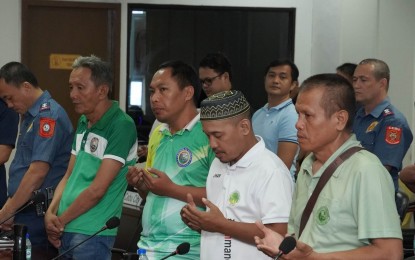 <p><strong>'SALAAM' MEETING</strong>. Muslim leaders recite prayers before their meeting with officials of the Police Regional Office (PRO-7) at the Camp Sergio Osmeña Sr. in Cebu City on Tuesday (Dec. 5, 2023). The meeting aims to promote cooperation amid the recent bombing of the Mindanao State University gymnasium in Marawi City on Sunday (Dec. 2, 2023). <em>(Photo courtesy of PRO-7 PIO)</em></p>