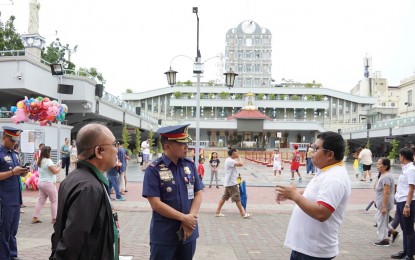 <p><strong>INSPECTION.</strong> Police Regional Office-7 chief, Brig. Gen. Anthony Aberin interacts with an Augustinian friar during his inspection at the Pilgrim Center of the Basilica Minore del Sto. Niño in Cebu City on Wednesday (Dec. 6, 2023). The PNP in Central Visayas is on full alert following the recent bombing in Marawi City. <em>(Photo courtesy of PRO-7)</em></p>