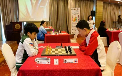 <p><strong>MASTERS.</strong> Filipino International Master Daniel Quizon (left) plays against Mongolian FIDE Master Munkhdalai Amilal in the fourth round of the Eastern Asia Juniors and Girls Chess Championship Open division at the Sabah Oriental Hotel in Kota Kinabalu, Malaysia on Dec. 8, 2023. The match ended in a draw. <em>(Contributed photo)</em></p>