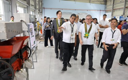<p><strong>AGRI MACHINERY.</strong> Agriculture Secretary Francisco Tiu-Laurel (center) inspects the Agricultural Machinery Design and Prototyping Center in Muñoz, Nueva Ecija on Thursday (Dec. 7, 2023). The AMDPC will provide farmers with affordable and locally manufactured machinery. <em>(Photo courtesy of Department of Agriculture)</em></p>