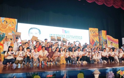 <p><strong>ISIP LAUNCH.</strong> Grantees of the Integrated Scholarships and Incentives Program (ISIP) for the Youth: Empowering Students through Education and Opportunity pose with officials, led by House Speaker Martin Romualdez (in black, middle row), during the launch at West Visayas State University’s cultural center in La Paz, Iloilo City on Saturday (Dec. 9, 2023). An initial 3,000 Ilonggo students will benefit from the program, a major component of the Bagong Pilipinas Serbisyo Fair. <em>(PNA photo by PGLena)</em></p>