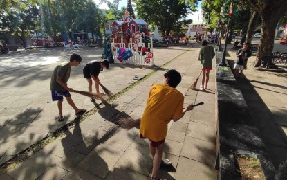 <p><strong>PUNISHMENT</strong>. Minor-offenders doing a clean-up activity in Maasin City, Southern Leyte in this Dec. 9, 2023 photo. The city government has required the 20 minors engaged in a recent riot to do community service as punishment. <em>(Photo courtesy of Mayor Nacional Mercado)</em></p>