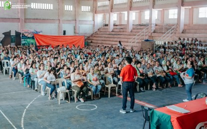 <p><strong>GOV'T AID</strong>. Camalig Mayor Carlos Irwin Baldo Jr. delivers his message to barangay health workers (BHWs) and barangay nutrition scholars (BNSs) who attended an awarding ceremony at the town gymnasium on Wednesday (Dec. 13, 2023). The local government unit released more than PHP2.5 million in cash assistance to BHWs and BNSs for their contributions and efforts to improve the health of the village residents.<em> (Photo courtesy of Camalig LGU)</em></p>