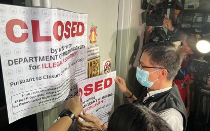 <p><strong>PADLOCKED.</strong> Department of Migrant Workers (DMW) Officer-in-Charge Undersecretary Hans Leo Cacdac on Friday (Dec. 15, 2023)  shuts down the Match Trend Training Assessment Center in Biak na Bato St., Quezon City for illegal recruitment. Match Trend is not an accredited agency of the DMW and does not have any legitimate job orders.  <em> (Photo courtesy of DMW) </em></p>