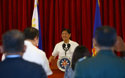 <p><strong>TOKYO-BOUND</strong>. President Ferdinand R. Marcos Jr. delivers his departure statement at the Villamor Air Base in Pasay City before leaving for Japan on Friday (Dec. 15, 2023). Marcos will be in Tokyo to participate in the Commemorative Summit for the 50th Year of Association of Southeast Asian Nations-Japan Friendship and Cooperation.<em> (PNA photo by Joan Bondoc)</em></p>