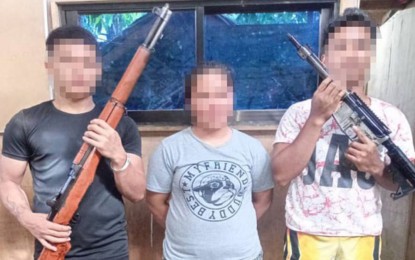 <p><strong>PEACEFUL SURRENDER</strong>. Three of the seven New People’s Army rebels who surrendered to the Philippine Army’s 36th Infantry Battalion on Thursday (Dec. 14, 2023) in Barangay Puyat, Carmen, Surigao del Sur. The rebels also handed over five high-powered firearms upon their surrender.<em> (Photo courtesy of 36IB)</em></p>