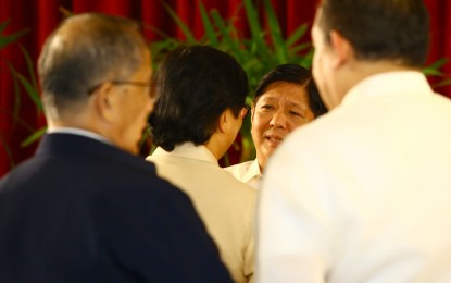 <p><strong>OFFICIAL DUTY.</strong> President Ferdinand R. Marcos Jr. talks to his Cabinet officials before departing from Villamor Air Base in Pasay City on Friday (Dec. 15, 2023). Marcos flew to Tokyo, Japan to attend the Commemorative Summit for the 50th Year of Association of Southeast Asian Nations-Japan Friendship and Cooperation slated Dec. 16 to 18.<em> (PNA photo by Joan Bondoc)</em></p>
<p><em> </em></p>