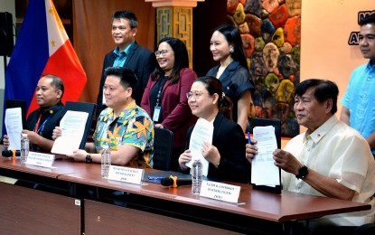 <p><strong>JOINT CIRCULAR FOR ELDERLY, PWDs.</strong> Department of Social Welfare and Development Secretary Rex Gatchalian (2nd from left), together with (from left) National Council on Disability Affairs OIC Deputy Executive Director Dandy Victa, Department of Budget and Management Director Sofia Yanto-Abad, and National Commission of Senior Citizens chairperson Franklin Quijano show the signed Joint Memorandum Circular (JMC) No.1, s. 2023 following ceremonies at the DSWD Central Office in Quezon City on Friday (Dec. 15, 2023). The JMC provides the guidelines on the proper reporting, monitoring, and utilization of funds for projects, programs, and activities for senior citizens and persons with disability (PWDs). <em>(PNA photo by Ben Briones)</em></p>