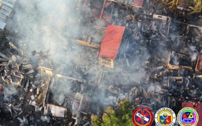 <p><strong>BURN</strong>. Three persons died while 72 families are now homeless after an early morning residential fire in Zone 3, Barangay Habog-Habog Salvacion, Molo, Iloilo City on Saturday (Dec. 16, 2023). The City Social Welfare and Development Office will release funds to assist the affected families. (<em>Photo courtesy of CDRRMO-Urban Search and Rescue</em>)</p>