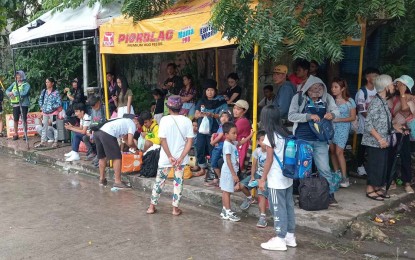 <p><strong>STRANDED.</strong> Some of the passengers bound for Panay Island are stranded at the Bredco port in Bacolod City on Monday (Dec. 18, 2023). A sea travel advisory issued by the Coast Guard District-Western Visayas showed the suspension of trips in various sea routes in northern Negros after Tropical Cyclone Wind Signal No. 1 has been hoisted all over Negros Occidental due to Tropical Depression Kabayan as of 11 a.m. <em>(Photo courtesy of Coast Guard Station Northern Negros Occidental)</em></p>