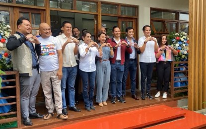 <p><strong>TOURIST REST AREAS</strong>. Department of Tourism Secretary Christina Garcia Frasco (center in blue jumpsuit) and Governor Gwendolyn Garcia (fourth from left) lead other officials in the inauguration of the 10th tourism rest area (TRA) in the Philippines at the wildlife adventure town in the north of Cebu on Monday (Dec. 18, 2023). Frasco underscored partnerships with LGUs and private stakeholders in opening more TRAs in the country. <em>(Contributed photo)</em></p>