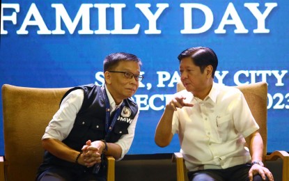 <p>President Ferdinand R. Marcos Jr. with newly-appointed Department of Migrant Workers Secretary Hans Leo Cacdac. <em>(PNA File Photo</em>)</p>