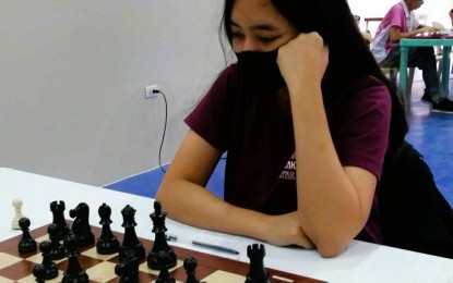 <p><strong>ON TRACK.</strong> Second seed Jallen Herzchelle Agra studies her next move against No. 4 Shaniah Francine Tamayo during their fifth-round match in the Queen of the North chess tournament at the Ilocos Norte National High School gymnasium in Laoag City on Wednesday (Dec. 19, 2023). Agra won after 23 moves of Caro-Kann defense to boost her title campaign. <em>(Contributed photo)</em></p>