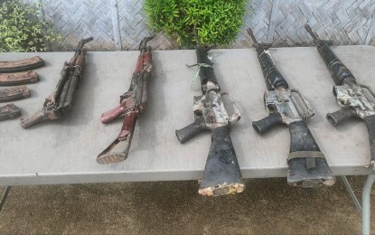 <p><strong>RECOVERED.</strong> Soldiers unearth an arms cache of the New People’s Army in the upland Mabini village in Basey, Samar on Dec. 19, 2023. The arms cache consisted of three M16 and two AK 47 assault rifles, the military said on Wednesday. <em>(Photo courtesy of Philippine Army)</em></p>