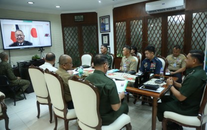 <p><strong>STRONG TIES.</strong> AFP chief Gen. Romeo Brawner Jr. (right) and senior military officials engage in a video conference with Japan Self-Defense Force joint chief of staff Gen. Yoshida Yoshihide at Camp Aguinaldo, Quezon City on Thursday (Dec. 21, 2023). Brawner and Yoshida discussed pressing regional security matters and developments in the Philippine-Japan defense partnership.<em> (Photo courtesy of the AFP)</em></p>