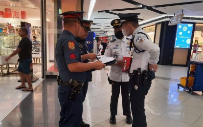 <p><strong>NO CHRISTMAS COSTUMES. </strong>PNP personnel hold an inspection of security guards at a mall in this undated photo. The PNP on Thursday (Dec. 21, 2023) warned security agencies and establishments to do away with the practice of making security guards wear Christmas costumes and giving them non-security tasks. <em>(Photo courtesy of PNP SOSIA)</em></p>