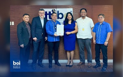 <p><strong>STRATEGIC INVESTMENT. </strong><span style="font-family: Arial, sans-serif; font-size: 9pt;">Trade Undersecretary and BOI Managing Head Ceferino S. Rodolfo (3rd from left) awards the Green Lane Certification to Ms. Lilibeth M. Rosenberger (4th from left), Triconti Windkraft Group President and CEO, at the BOI main office in Makati City on Dec. 6, 2023.  The project under green lane costs PHP81.68 billion. <em>(Photo courtesy of BOI) </em></span></p>