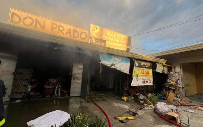 <p><strong>FIRE.</strong> Smoke rises from a commercial building hit by fire in Barangay 2 Garreta, Badoc, Ilocos Norte on Wednesday (Dec. 27, 2023). The Bureau of Fire Protection (BFP) urged the public anew to take all necessary precautions to avoid fire leading up to New Year’s Day.<em> (Photo courtesy of BFP-Badoc)</em></p>