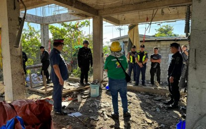 <p><strong>INSPECTION</strong>. Investigators and officials visit the site where firecrackers stored in a house under construction in Barangay Malued, Dagupan City, Pangasinan accidentally exploded on Dec. 25, 2023, reportedly after a lighted cigarette was thrown. The explosion injured five individuals, one of whom eventually died as reported by authorities on Friday (Dec. 29). <em>(Photo courtesy of Mayor Belen Fernandez Facebook)</em></p>