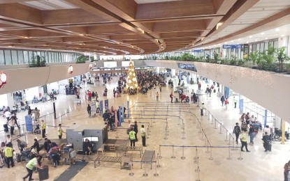 <p><strong>CONTINUOUS IMPROVEMENT.</strong> Photo shows passengers at the Ninoy Aquino International Airport Terminal 1 on Dec. 28, 2023. The public could expect a more seamless passenger experience, increased passenger capacity, infrastructure improvement, and digitalization starting next year. (<em>PNA photo by Cristina Arayata</em>) </p>