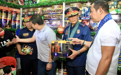 <p><strong>PNP-LGU COOPERATION.</strong> Philippine National Police chief Gen. Benjamin Acorda Jr. (2nd from right) and Governor Daniel Fernando (right) lead the inspection of fireworks stalls at the Santiago Compound in Barangay Turo, Bocaue, Bulacan on Friday (Dec. 29, 2023). Acorda said the active support of local government units and fireworks manufacturers is crucial to the success of the PNP’s intensified campaign against illegal firecrackers. <em>(PNA photo by Robert Oswald P. Alfiler)</em></p>