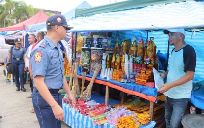 <p><strong>SAFETY FIRST.</strong> Police Eastern Visayas Director Brig. Gen. Reynaldo Pawid inspects firecrackers sold in Tacloban City, Leyte on Friday (Dec. 29, 2023). The move is part of the police campaign to support the Department of Health in ensuring a safe and peaceful holiday celebration in the region. <em>(PNA photo by Roel Amazona)</em></p>