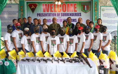 <p><strong>NEUTRALIZED.</strong> Communist Party of the Philippines-New People's Army members pose with military officials in one of the ceremonies held for their surrender. Visayas Command commander, Lt. Gen. Benedict Arevalo said on Saturday (Dec. 30, 2023) that the severe reduction in manpower and armed capability of the insurgents significantly contributed to the clearing of 343 NPA-infested communities in Visayas. <em>(Photo courtesy of Viscom-PIO)</em></p>