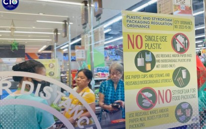 <p><strong>NO PLASTIC BAG.</strong> A major store in Tacloban City with signage informing customers about the plastic ban ordinance in this Jan. 3, 2024 photo. The city government has started this year enforcing an ordinance regulating the use of plastic and styrofoam for packaging in business establishments. <em>(Photo courtesy of Tacloban City information office)</em></p>