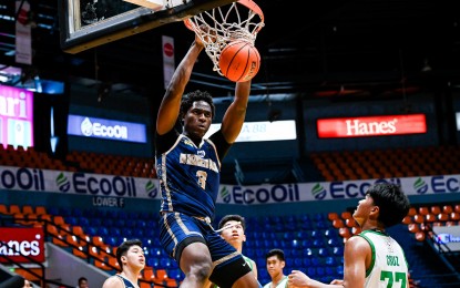 <p><strong>MVP RACE LEADER</strong>. National University Nazareth School center Collins Akowe scores a dunk during the game against De La Salle-Zobel in the first round of the UAAP Season 86 high school boys’ basketball tournament last year. The Nigerian is leading the race for the Most Valuable Player award.<em> (UAAP photo)</em></p>