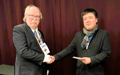 <p><strong>BOARD MASTER.</strong> Filipino Kim Zafra (right) is congratulated by tournament director Jonas Sandbom for winning the Rilton Cup international chess tournament at Scandic Continental Hotel in Stockholm, Sweden on Jan 5, 2024. Zafra is based in Estonia. <em>(Contributed photo)</em></p>