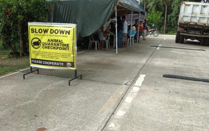 <p><strong>MICROSCOPIC ENEMY</strong>. An animal quarantine checkpoint in Odiongan, Romblon on Monday (Jan. 8, 2024). Strict quarantine measures continue to be enforced on live pigs and pork being transported to and from the town as part of state of calamity protocols.<em> (Photo courtesy of Municipal Agriculture Office)</em></p>