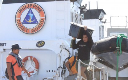 <p><strong>RESUPPLY.</strong> Philippine Coast Guard (PCG) personnel drop off necessary supplies at PCG stations at the Kalayaan Island Group during a mission from Jan. 3 to 9, 2024. The PCG said the mission, performed by BRP Cabra and BRP Sindangan, was successfully completed despite shadowing by a China Coast Guard vessel. <em>(Photo courtesy of PCG)</em></p>