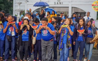 <p><strong>PAKWAN FEST</strong>. Residents enjoy eating sliced watermelon during the Pakwan Festival in 2020 at Bani town, Pangasinan. The grand celebration was halted during the pandemic. The town will again stage its Pakwan Festival on Jan.27 to Feb. 4, 2024. <em>(Photo courtesy of Bani LGU)</em></p>