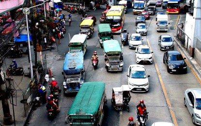 <p><strong>PUBLIC TRANSPORT.</strong> Several traditional jeepneys, taxis and buses ply Pasay Rotonda at the intersection of EDSA and Taft Avenue in Pasay City on Jan. 4, 2024. Ranking transportation officials have begun drafting guidelines to implement mandatory speed limiters in all public utility vehicles as part of the government's push for safer roads. <em>(PNA photo by Ben Briones)</em></p>