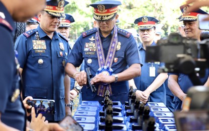 <p><strong>NEW ASSETS.</strong> Police officials led by PNP Gen. Benjamin Acorda Jr. inspect the new equipment and assets of the force during the blessing rites at Camp Crame, Quezon City on Monday (Jan. 15, 2024). The PNP has acquired some PHP485 million worth of firearms, mobility and protection equipment. <em>(PNA photo by Robert Oswald Alfiler)</em></p>