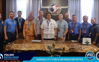 <p><strong>TEMPEST WIND.</strong> Surigao City Mayor Pablo Yves Dumlao II (center) welcomes on Monday (Jan.15, 2024) the delegates from the U.S. Special Operations Command Pacific. The visit is in line with the preparations for the upcoming Tempest Wind exercise, which will be held this year in Surigao del Sur and Surigao City.<em> (Photo courtesy of Surigao CIO)</em></p>