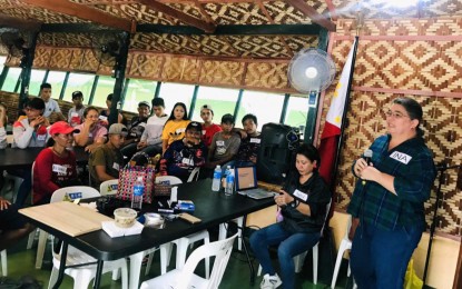 <p><strong>TRAINING-WORKSHOP.</strong> Christina Marie Gaston (right), chairwoman of the Association of Negros Producers, and Sybel Nobleza (seated), external affairs manager of ANP, with the participants of the product development and basic marketing workshop in Barangay Riverside, Isabela, Negros Occidental. The Philippine Army’s 62nd Infantry Battalion hosted the training workshop held in December 2023 at its headquarters in Barangay Libas. (<em>Photo courtesy of Association of Negros Producers</em>)</p>