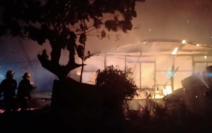 <p><strong>EARLY MORNING BLAZE</strong>. A house in downtown Puerto Princesa is in flames on Wednesday (Jan. 17, 2024). There were no fatalities but one resident sustained second-degree burns.<em> (Photo courtesy of the Bureau of Fire Protection-Puerto Princesa)</em></p>