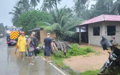 <p><strong>BAD WEATHER.</strong> Members of the Mati City Disaster Risk Reduction Management Office (CDRRMO) in Davao Oriental province launch rescue operations for flood-affected residents in Barangay Bobon on Thursday (Jan. 18, 2024). The NDRRMC reported that heavy rains caused by the shear line have so far affected 44,888 families in the Davao Region. <em>(Photo courtesy of Mati City Information Office)</em></p>