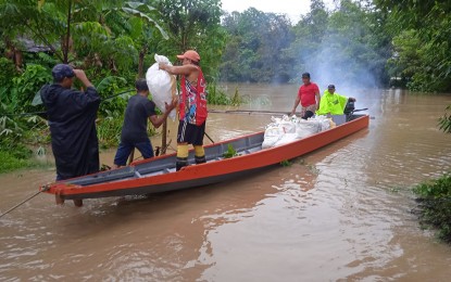 <p><strong>RELIEF OPS.</strong> Personnel of the local government of Veruela town in Agusan del Sur carryout relief operations for families affected by floodwaters in 12 barangays on Thursday (Jan. 18, 2024). The municipal social welfare office reported that the flooding caused by the shear line has so far displaced 3,284 families. <em>(Photo courtesy of Veruela MPS)</em></p>