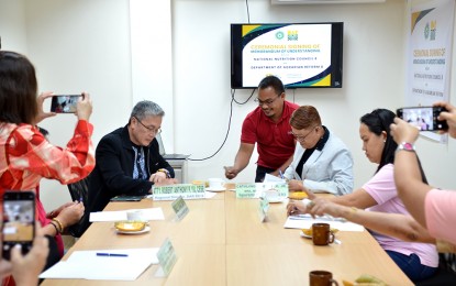 <p><strong>FIGHTING MALNUTRITION.</strong> The signing of a memorandum of understanding between key regional officials of the Department of Agrarian Reform (DAR) and the National Nutrition Council in Eastern Visayas in this Jan. 19, 2024 photo. The new partnership agreement seeks to carry out the dietary supplementation program in agrarian reform communities in the region. <em>(Photo courtesy of DAR)</em></p>
<p> </p>