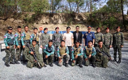<p><strong>ALL PRIMED UP.</strong> Interior and Local Government Secretary Benhur Abalos (in white) poses with members of the Philippine National Police who will represent the country in the 2024 UAE SWAT Dubai Police Challenge during his visit at the Special Action Force Headquarters in Camp Bagong Diwa, Bicutan on Friday (Jan. 19, 2024). Abalos urged the Philippine contingent to take note of the advancements made by other countries, which will help improve the local cops' abilities to ensure peace and order in the communities. <em>(Photo courtesy of DILG)</em></p>