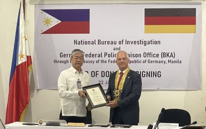 <p><strong>COLLABORATION.</strong> National Bureau of Investigation Director Medardo De Lemos (left) receives a deed of donation from German Ambassador to Manila Dr. Andreas Pfaffernoschke at the NBI headquarters in Quezon City on Monday (Jan. 22, 2024). Germany's Federal Police Liaison Office donated laptops, scanners, photocopiers, printers, and desktop computers, among others. <em>(Photo courtesy of NBI-PIO)</em></p>