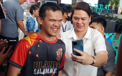 <p><strong>SELFIE WITH VP.</strong> Vice President and concurrent Education Secretary Sara Z. Duterte takes a selfie with a visually impaired student during the fourth founding anniversary of the City College of Davao in Davao City on Monday (Jan. 22, 2024). Duterte said the possibility of reverting to a June-March school calendar is ongoing. <em>(PNA photo by Robinson Niñal Jr.)</em></p>