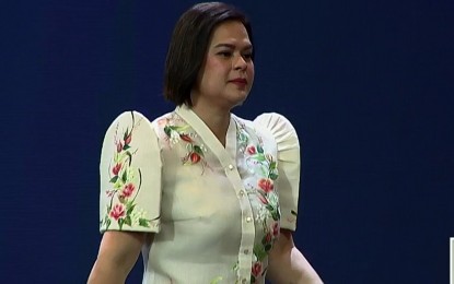 <p><strong>BER 2024.</strong> Vice President and Education Secretary Sara Z. Duterte walks up the stage as she was called to deliver the Basic Education Report (BER) 2024 held on Thursday (Jan. 25, 2024) at Sofitel Plaza Hotel in Pasay City. She cited the teachers and personnel of the Department of Education and their efforts to what the agency has accomplished.<em> (Screenshot from RTVM livestream)</em></p>