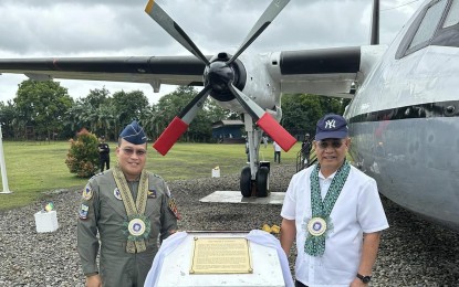 <p><strong>HISTORIC AIRCRAFT.</strong> Lt. Gen. Stephen Parreño (left), Philippine Air Force commanding general, and Silay City Mayor Joedith Gallego unveil the marker for the retired Fokker F27-200 Friendship plane at the People’s Park in Barangay E. Lopez on Friday (Jan. 26, 2024). The 65-year-old aircraft, which once served as the presidential plane of the late President Ferdinand E. Marcos, is now a tourist attraction in Silay City, Negros Occidental. (<em>Photo courtesy of Mayor Joedith C. Gallego Facebook page</em>)</p>