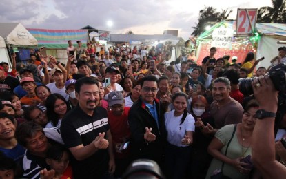 <p><strong>ASSISTANCE TO VENDORS.</strong> Senator Lito Lapid, Tourism Infrastructure and Enterprise Zone Authority general manager Mark Lapid, and Iloilo City lone district Rep. Julienne Baronda pose with vendors at the Iloilo Fish Port Complex during the distribution of their cash assistance on Saturday (Jan. 27, 2024). The two government officials joined Ilonggos in celebrating the Iloilo 2024 Dinagyang Festival. <em>(PNA photo by PGLena)</em></p>
<p> </p>
<p> </p>