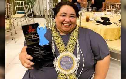 <p><strong>RETIREMENT.</strong> Para powerlifter Adeline Dumapong-Ancheta receives recognition during the 2023 Extraordinary Filipino with Disabilities award held by the National Council on Disability Affairs in December last year. Ancheta on Wednesday (Jan. 31, 2024) announced her retirement after 25 years of a successful journey as one of the country’s top para-athletes.<em> (Contributed photo)</em></p>