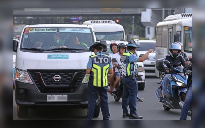 <p><strong>ANTI-COLORUM OPS.</strong> Personnel of the Land Transportation Office Central Office carry out an operation along Aurora Boulevard in Quezon City on Nov. 9, 2023. The Special Action and Intelligence Committee for Transportation on Thursday (Feb. 1, 2024) reported that 44 colorum or unregistered public utility vehicles were fined a total of PHP17.4 million in January alone. <em>(PNA photo by Joey O. Razon)</em></p>